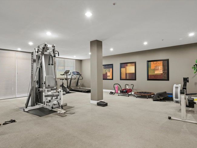 Exercise room with recessed lighting and carpet floors | Image 17