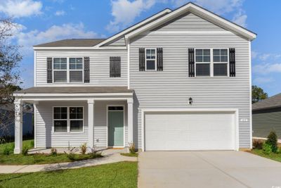 View of front of property with a garage | Image 1