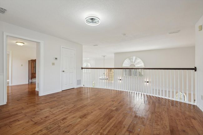 Upstairs flex space featuring hardwood / wood-style floors | Image 27
