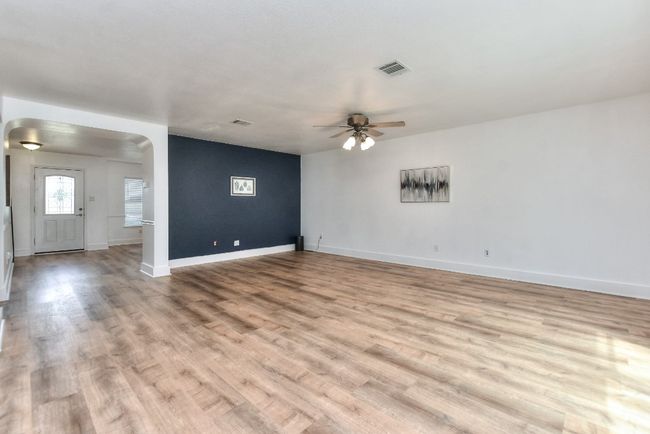 In this picture you see the front door entry and have walked past the front flexible dining space into an enormous open family room! | Image 7