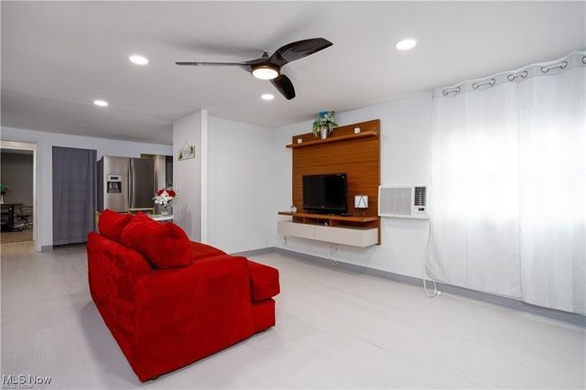 Living area with ceiling fan and recessed lighting | Image 4
