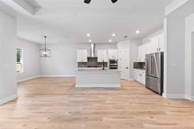 The dining area is open to both kitchen and entertaining areas, allowing a great flow from room to room. | Image 3