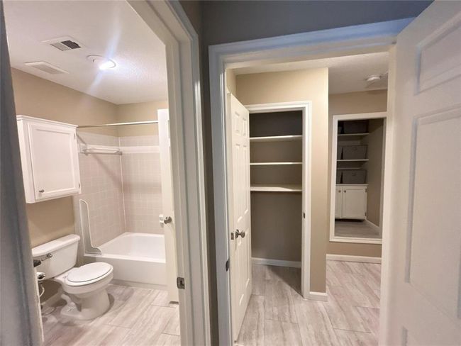 Here is the Jack and Jill set up. Just outside the bath in the hall are two additional closets! The upstairs has vinyl flooring. | Image 32
