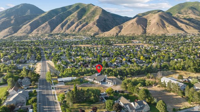 Aerial view of property and surrounding area featuring nearby suburban area and mountains | Image 101