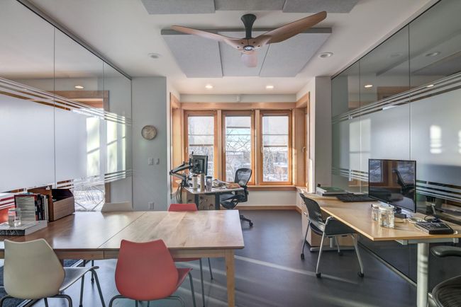 Another view of glass enclosed private office with furniture in it. | Image 16