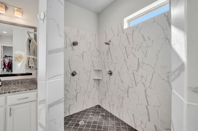 Bathroom with tiled shower and vanity | Image 18