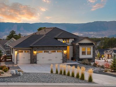 Front of house with mountain range in the background | Image 1