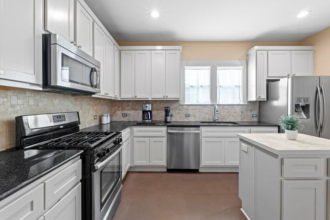 Functional layout for the kitchen with stainless steel appliances. | Image 19