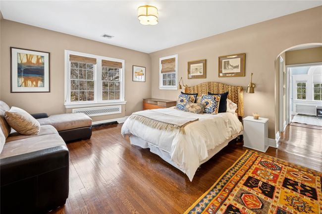 Fourth Bedroom featuring arched walkways, dark wood-type flooring | Image 28