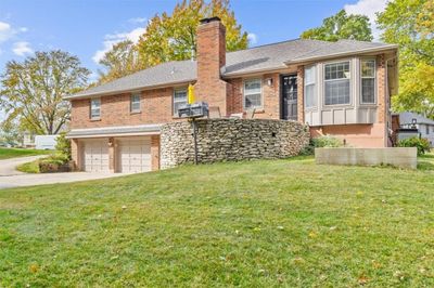 View of front of house with a front lawn and a garage | Image 3