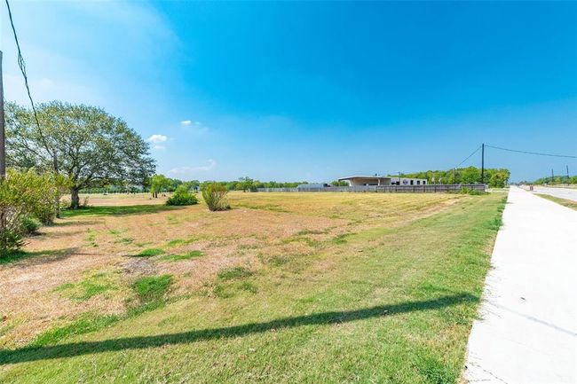 View looking west from the front of the property. McHard is to the right. | Image 15