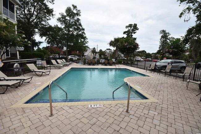 Community pool with a patio | Image 5