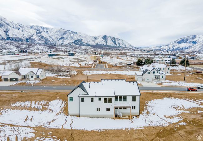 Snowy aerial view featuring a mountain view | Image 18