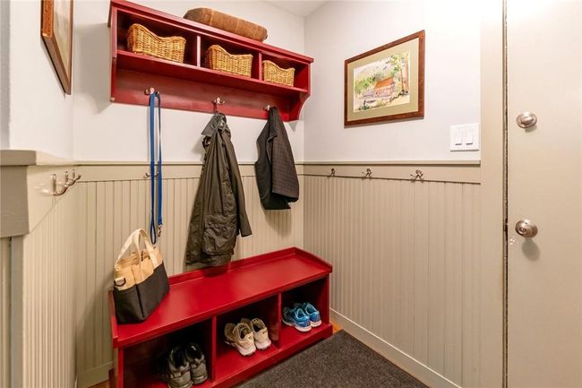 Mudroom with door to the two car garage. | Image 13