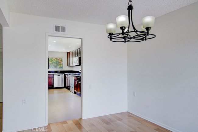 Another view of the dining room looking towards the entrance to the kitchen. | Image 11