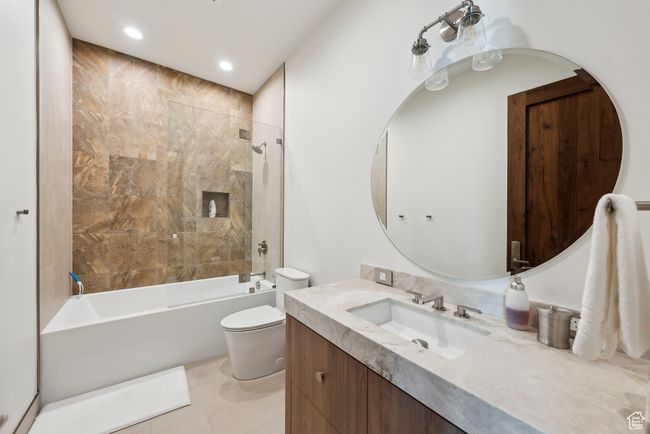 Full bathroom featuring vanity, toilet, shower / bathtub combination, and recessed lighting | Image 36