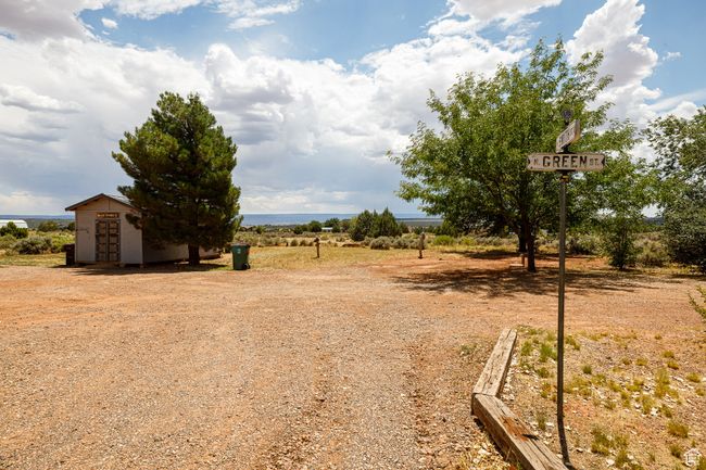 View of yard featuring a rural view and a storage shed | Image 38