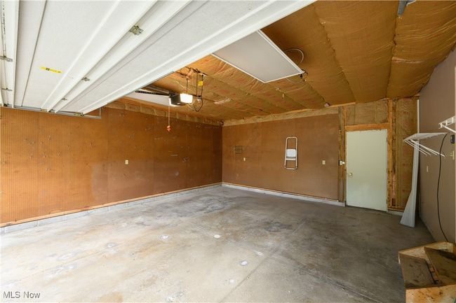 Garage featuring a garage door opener | Image 27