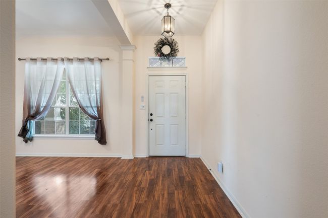 Entrance foyer featuring dark wood-type flooring and baseboards | Image 7