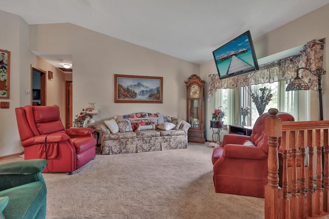 Vaulted living room. Neutral colors throughout. | Image 19