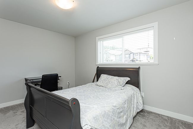 Bedroom with baseboards and carpet floors | Image 7