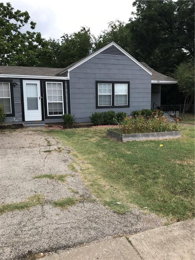 Single story home with a front lawn and roof with shingles | Image 13