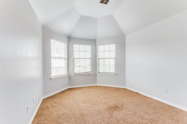 Spare room with light colored carpet, healthy amount of natural light, and vaulted ceiling | Image 30