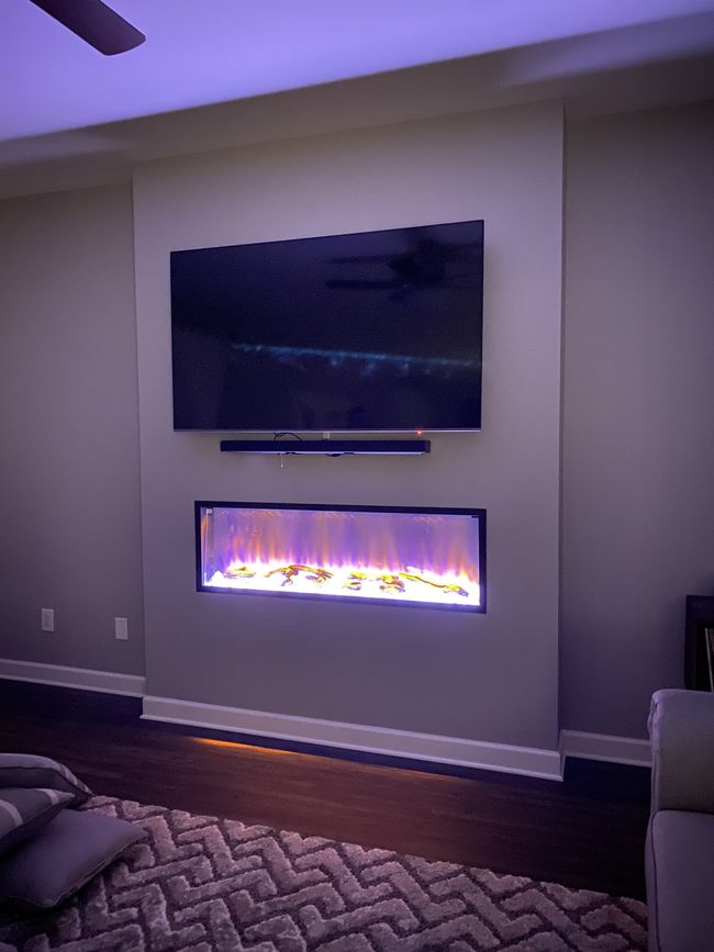 The fireplace has a remote so you can show whatever color fits the moment | Image 16