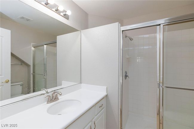 Full bathroom with vanity, visible vents, and a stall shower | Image 21