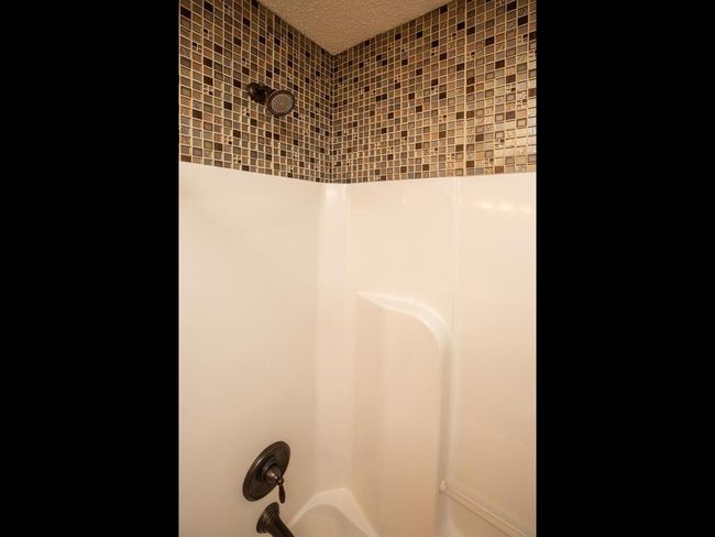 Accent tile above tub surround | Image 28