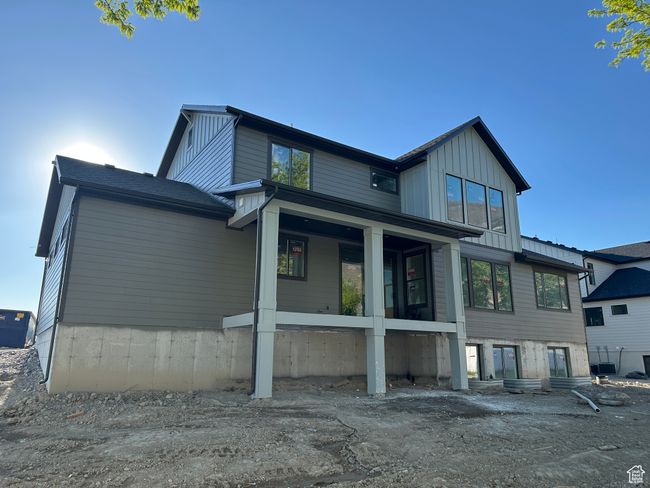 Rear view of house featuring board and batten siding | Image 36