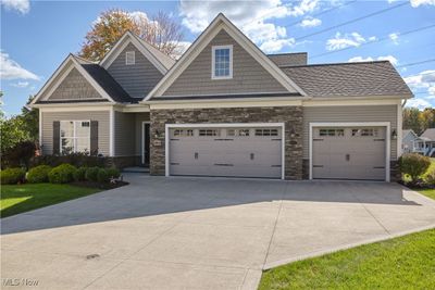 Craftsman house with a front yard and a garage | Image 3