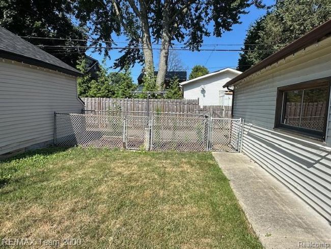 View of yard with a gate | Image 4