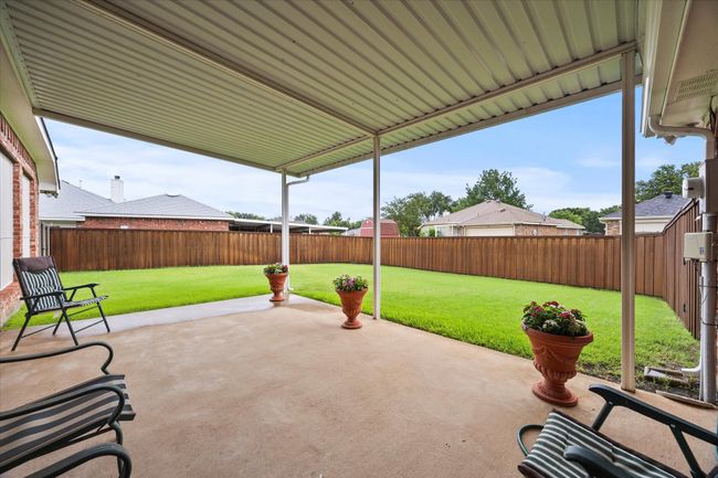 Fenced backyard featuring a patio area | Image 27