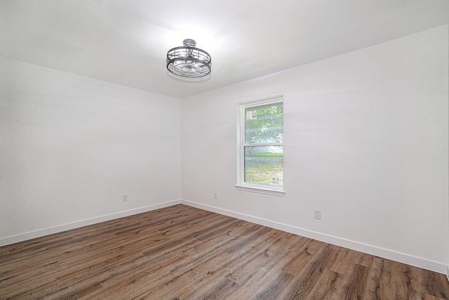 Unfurnished room featuring wood finished floors and baseboards | Image 30