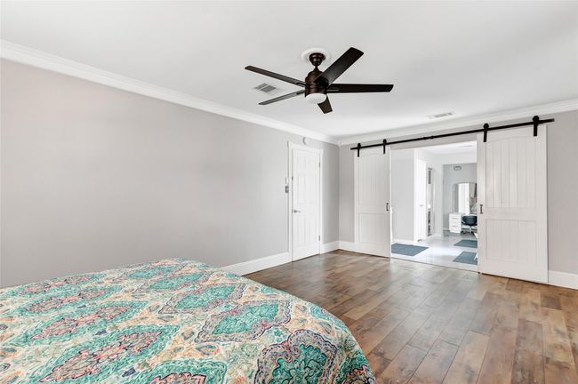 Decorative barn doors lead to the stunning primary bathroom! | Image 16