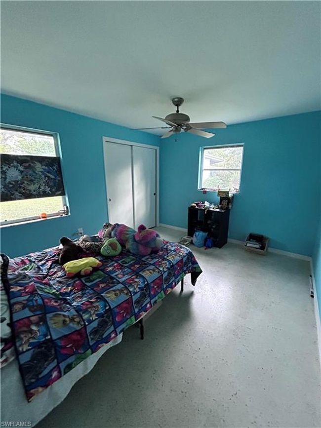Bedroom with a closet and ceiling fan | Image 13