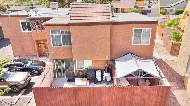 Back of Condo featuring enclosed backyard | Image 15