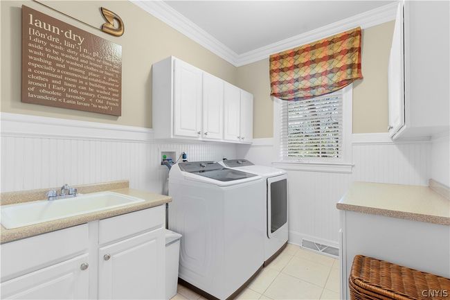 View of the island with Wolf Microwave, Double Ovens, Warming Drawer, and Subzero. Dishwasher is Kitchen Aid. | Image 21