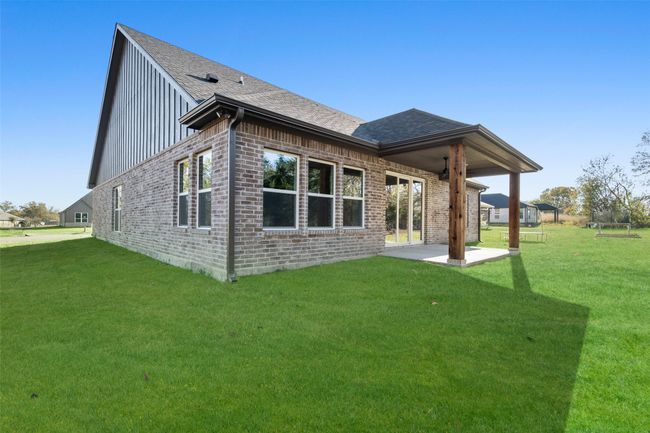 Back of property featuring a patio area and a yard | Image 24