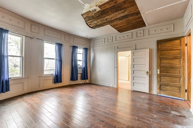 Primary bedroom is on the first floor | Image 9