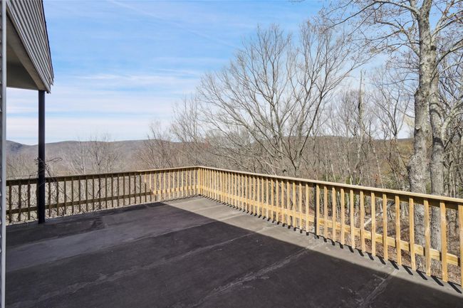 Wooden terrace with a patio area | Image 30