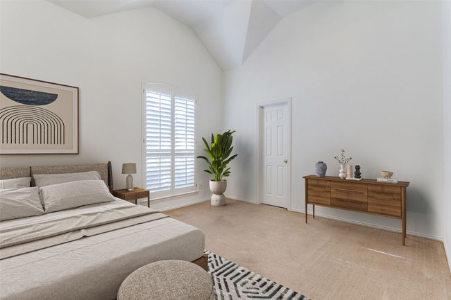 Bedroom featuring carpet flooring, high vaulted ceiling, and baseboards | Image 27