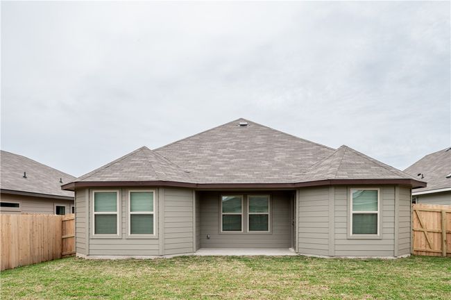 Back of house featuring a patio area, a lawn, a fenced backyard, and a shingled roof | Image 24
