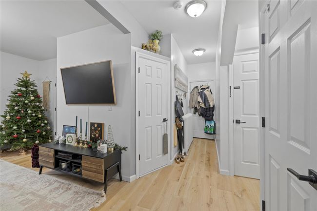 Hall with light hardwood / wood-style floors | Image 7