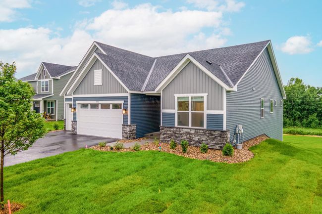 Nestled on a prime lot in a new development, this home backs up to a lush nature area. | Image 44