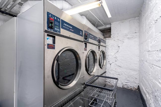 Common laundry area with washer and clothes dryer | Image 12
