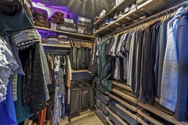 Spacious closet featuring wood finished floors | Image 12