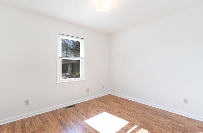 Spare room with hardwood / wood-style flooring | Image 17