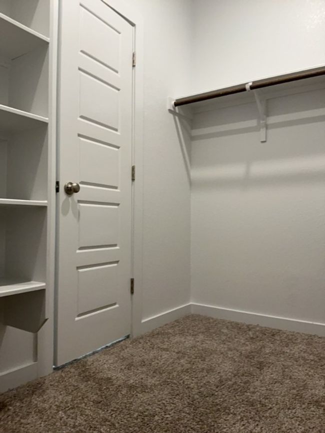 Spacious closet with carpet | Image 23